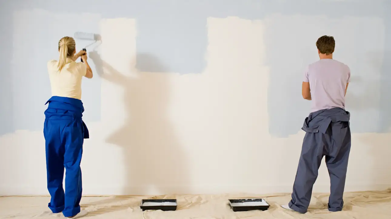 Affordable Painter painting interior walls of a modern home