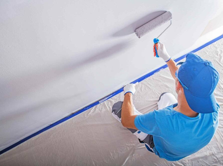 Eco-Friendly Painter applying non-toxic paint in a modern home interior.